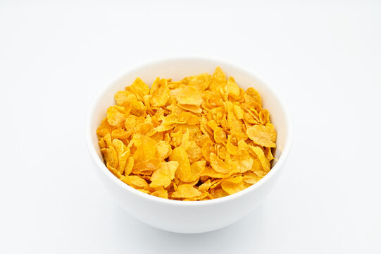 Corn Flakes, in a white bowl, isolated on a white background