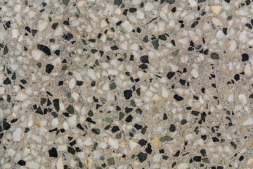 Floor tiles decorated with polished gravel. Background and texture concept