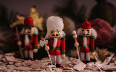 Christmas decorations - the nutcracker and, on the background of decorations.