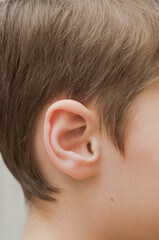 Close-up of an 8-year-old boy's ear