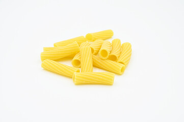 Raw Tortiglioni pasta, isolated on a white background