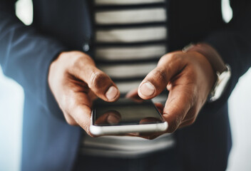 Reach out and make new connections. Closeup shot of an unrecognizable businessman using a cellphone in an office.