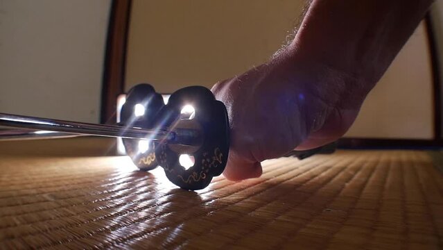 Samurai swords being drawn on tatami
