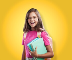 Happy school girl wearing glasses, holding backpack going to school, enjoying studying,