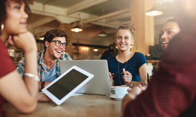 Study groups are the perfect place to find new perspectives. Shot of students studying in a coffee shop.