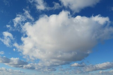 Beautiful big fluffy cloud in blue sky, natural clouds background