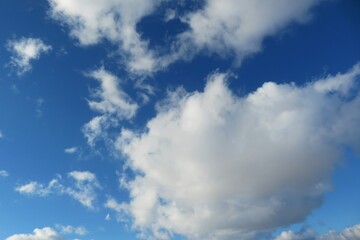 Naklejka na ściany i meble Blue sky with beautiful big fluffy cloud, natural background