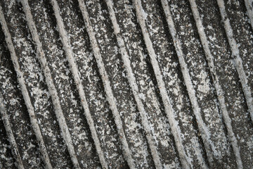 Abstract surface wallpaper of black and white paving stone in the garden with stripe line texture for a dark background.