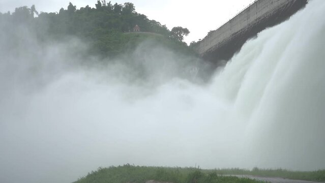 Hydroelectric dam Floodgate with flowing water through gate and Open the springway Khun Dan Prakan Chon Dam in nakhon nayok Thailand