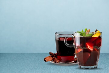 Apple cider with slices, cinnamon and anise stars in transparent cups. Seasonal apple mulled wine