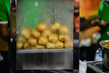 Street foods at a night food festival held in Galle Fort, Sri Lanka. ready to eat Buns keep hot in...