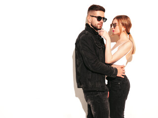 Sexy smiling beautiful woman and her handsome boyfriend. Happy cheerful family having tender moments.Young passionate couple hugging. Sensual pair isolated on white. Cheerful and happy