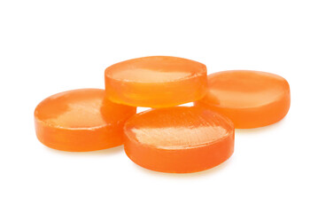 Fototapeta na wymiar Orange cough drops on white background. Pharmaceutical product
