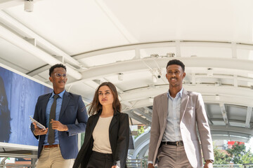 Group of business people.Business people meeting talking and sharing their ideas in city. Business team and teamwork concept. Business people standing outside in the city discussing about new project.