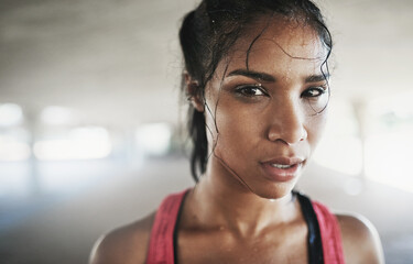 Time to get my fit on. Shot of a young woman getting fit outside.