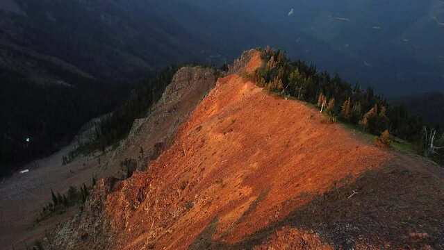 Sunset flying down the ridge in South Rockies, British Columbia, aerial shot