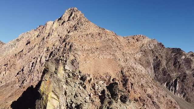 Aerial shot of mountain peaks in South Rockies, backward movement
