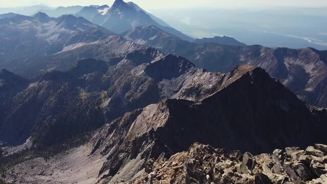 Flyover ridgeline high in the Canadian South Rocky mountains, aerial shot