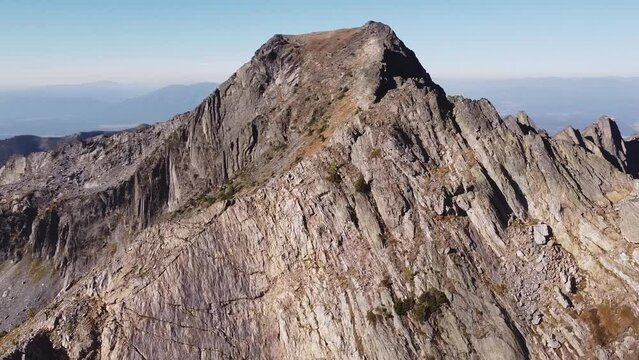 Orbiting around mountain peak high in the alpine of South Rockies