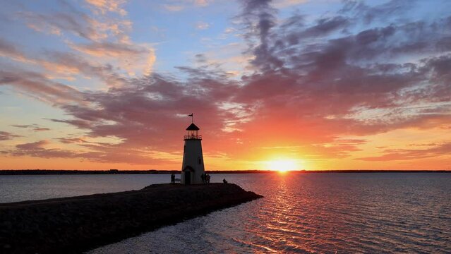 Sunset slow motion of the beautiful afterglow over the lighthouse of Lake Hefner