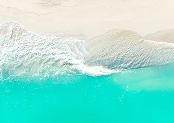 Fotobehang The texture background of summer beach wave water seashore sand beach -Summer pattern image © SASITHORN