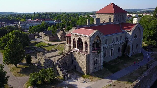 Cinematic 4K aerial drone 360 shot of the charming historic medieval Tata Castle and Öreg lake in Komárom-Esztergom county Hungary