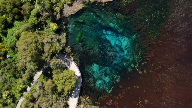 Aerial View Of Te Waikoropupu Springs With Bubbling And Crystal Clear Water In Golden Bay, New Zealand. - orbit