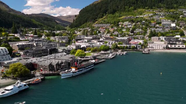 TSS Earnslaw historic coal-fired steamship in Queenstown port. Beautiful sunny day in New Zealand famous resort town on lake Wakatipu