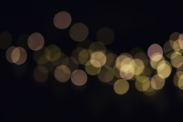 Fototapeta premium Abstract bokeh background. Golden bokeh circles on dark blue background. Layer overlay.