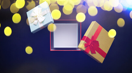 Christmas decoration. Gift boxes on black stone  background. Christmas greeting card concept.