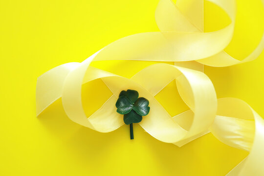 St. patrick's day background. Religious Christian Irish celebration. Bow with four-leaf clover symbol of good luck.