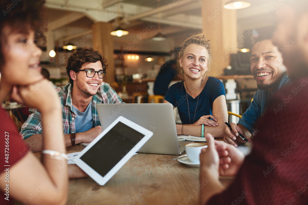 Poster Study groups stimulate interest and increases confidence. Shot of students studying in a coffee shop.