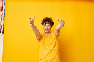 Young curly-haired man Youth style studio casual wear isolated background unaltered