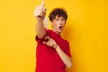 Young curly-haired man in protective masks safety posing isolated background unaltered