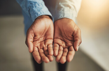 You rise by lifting others. Cropped shot of two open hands.