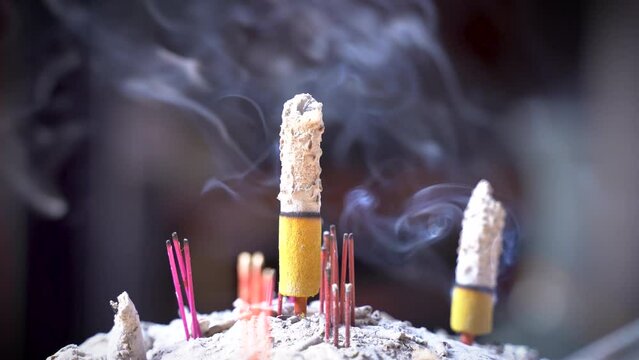 Burned joss stick, incense stick in a censer in Chinese temple