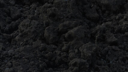 Plowed soil. The field is ready for agricultural work. Black soil. Farming field