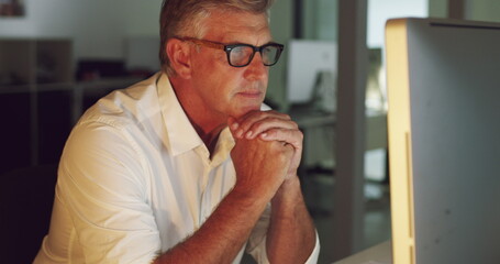 Ambition is a driving force behind business growth and success. 4k video of a mature businessman working late on a computer in an office.