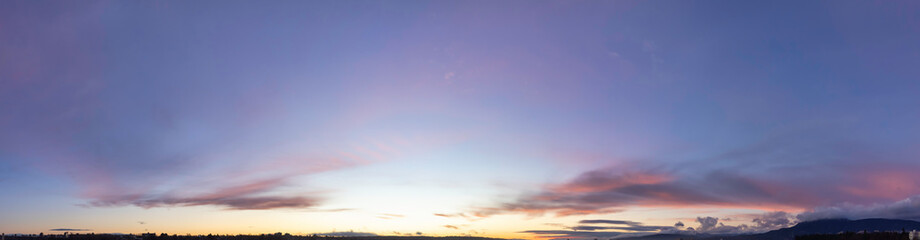 Panoramic View of Cloudscape during a colorful sunset or sunrise. Taken on the West Coast of British Columbia, Canada. Nature Background Panorama