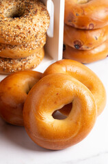 Stacks of Various Flavors of Bagels on a Counter