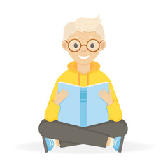 Happy smiling boy with glasses reading book. Сhild sits with a book in his hands. Isolated on white background.