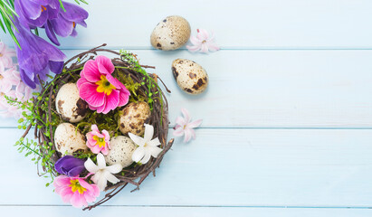 Fototapeta na wymiar Nest with eggs decorated with flowers. Image with selective focus