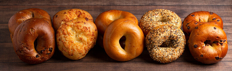  Variety of Different Flavored Bagels on a Wood Table