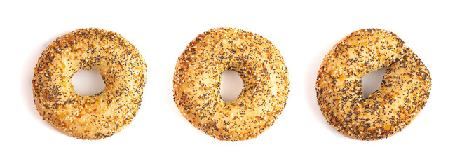 A Row of Three Evertything Bagels Isolated on a White Background - obrazy, fototapety, plakaty