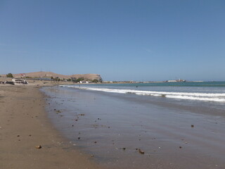 Photograph taken on a sunny day around Arica City at Chili, showing the architecture and colours of this historical place. Streets, beach, cemetery, desert, houses, square.