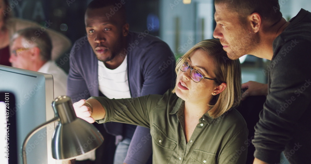 Poster outlining her ideas to the team. 4k video of a group of businesspeople working late on a computer in