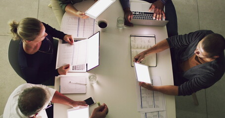 Hard at work putting success into place. 4k video footage of a group of businesspeople having a meeting in an office.