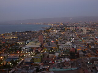 Fototapeta premium Photograph taken on a sunny day around Arica City at Chili, showing the architecture and colours of this historical place. Streets, beach, cemetery, desert, houses, square.