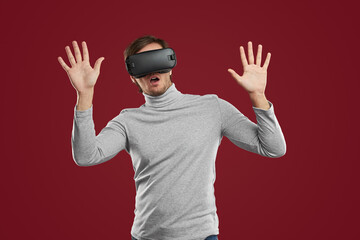 Fototapeta premium Scared man playing videogame in virtual reality