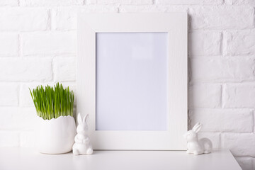 Mockup with a white frame and easter decor.